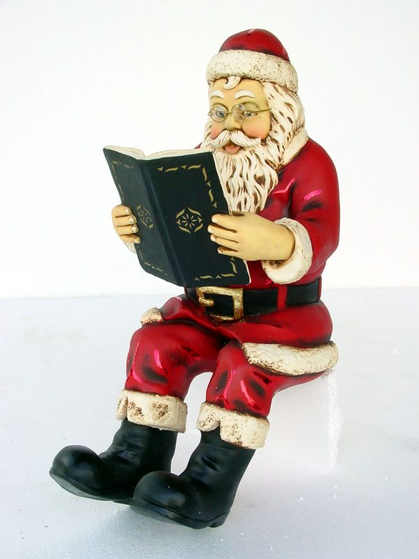 SANTA SITTING WITH BOOK