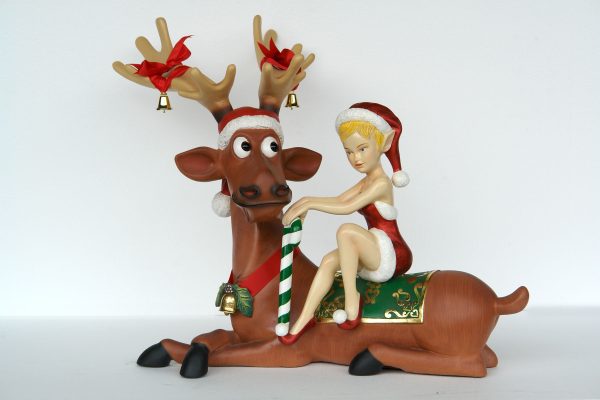 Lady Elf Sitting on Funny Reindeer