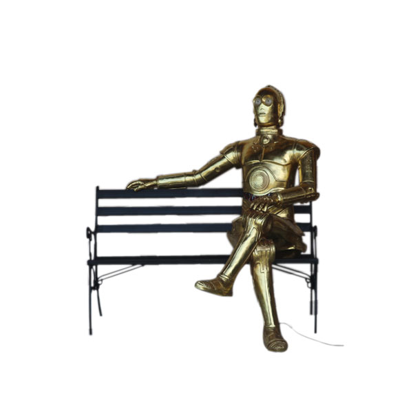 ANDROID SITTING ON A BENCH