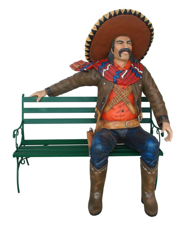 MEXICAN COWBOW SITTING ON BENCH