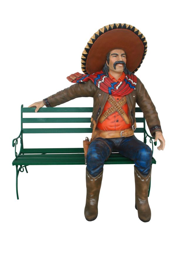 MEXICAN COWBOW SITTING ON BENCH