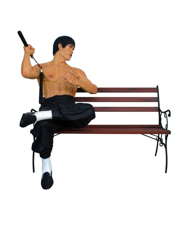 KUNG-FU FIGHTER SITTING ON A BENCH