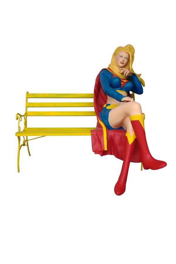 MUSCLE GIRL SITTING ON BENCH