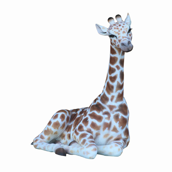 GIRAFFE SITTING