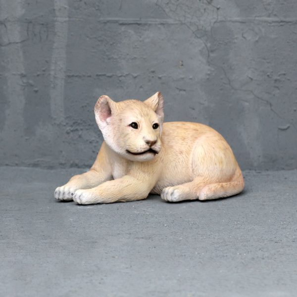 LION CUB LYING