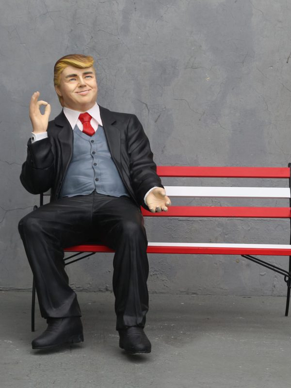 DONALD TRUMP SITTING ON BENCH