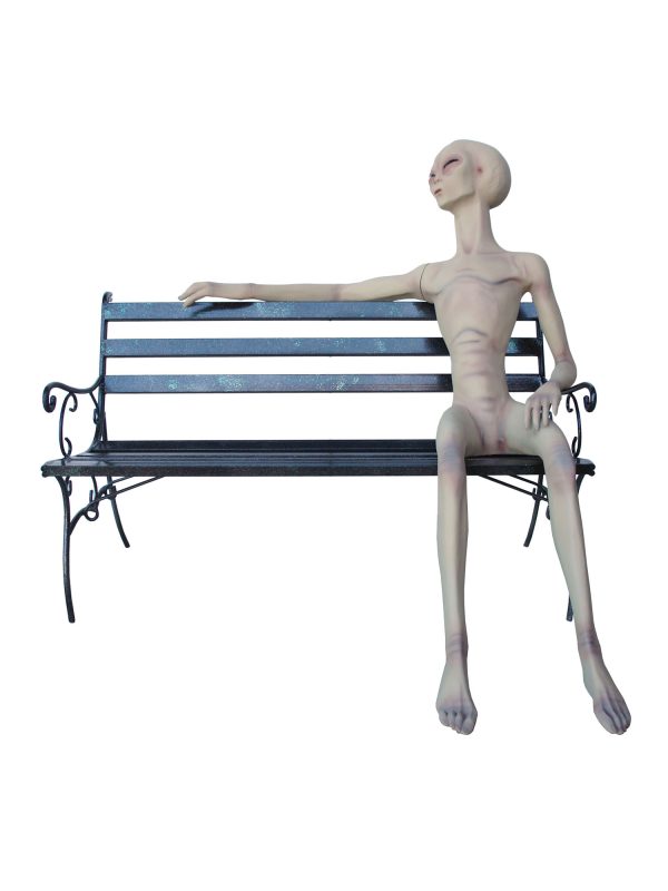 ALIEN SITTING ON BENCH