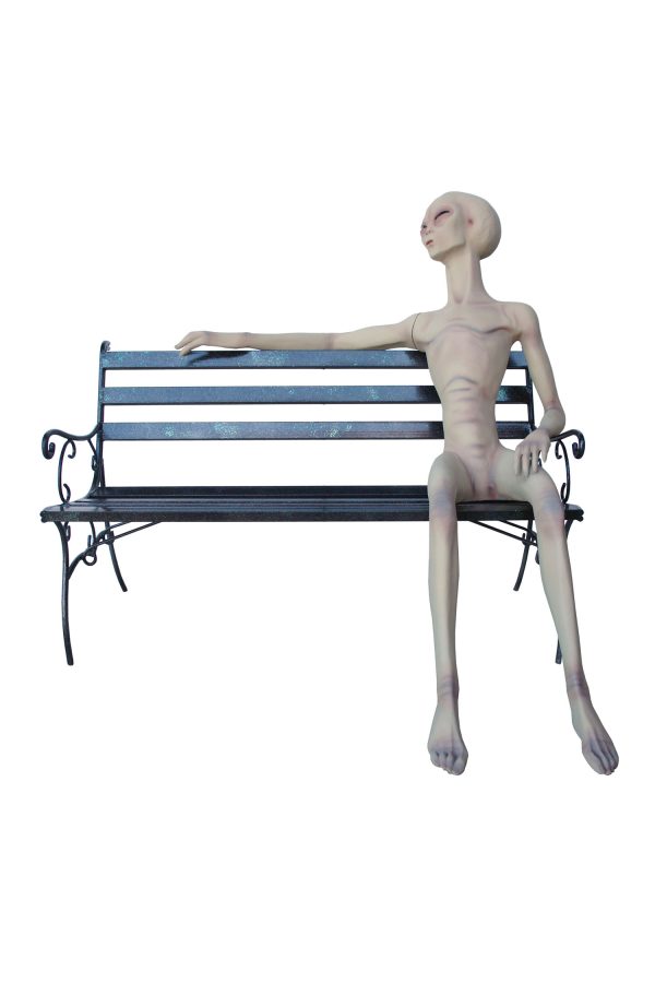 ALIEN SITTING ON BENCH